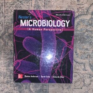 Microbiology Textbook with Black and Pink Spine